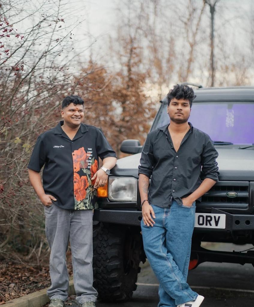 Recent photo of Vishnu Dethan and Krishna Dethan with Land Rover Discovery in the UK